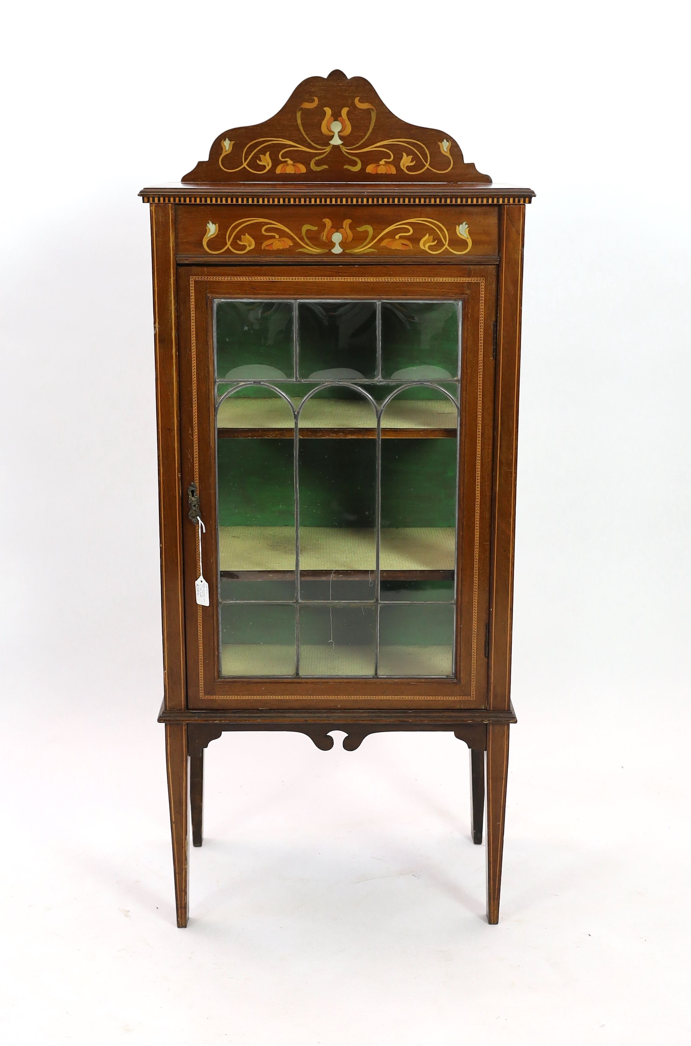 An Edwardian Art Nouveau inlaid mahogany display cabinet, with leaded glazed door, width 56cm depth 35cm height 132cm